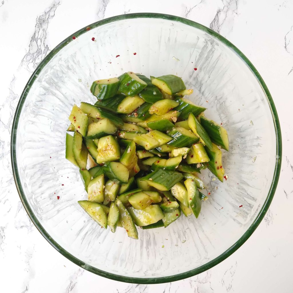 mixing the smashed cucumber salad