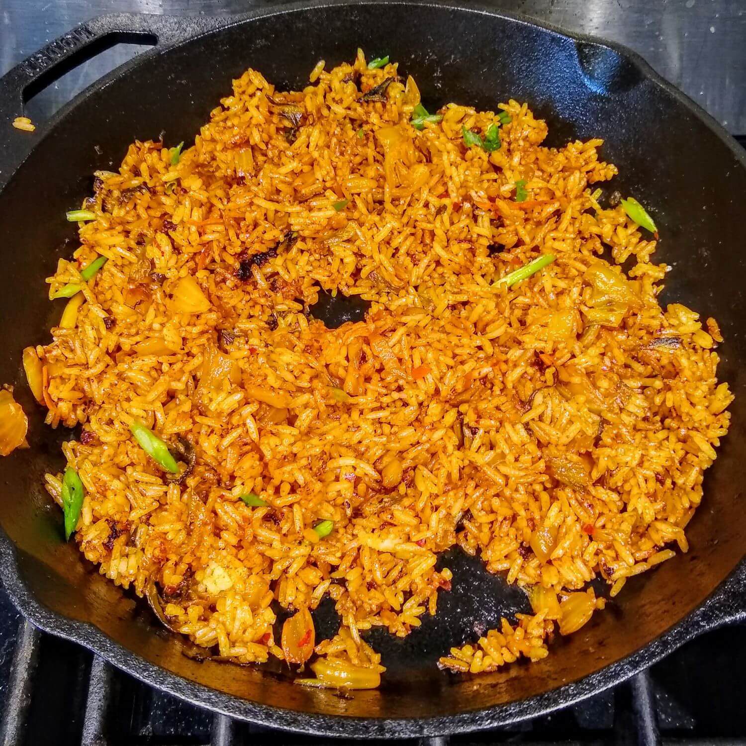 Added The Rice, Green Onions, and Kimchi Juice to the Kimchi Bokkeumbap/ Vegetarian Kimchi Fried Rice