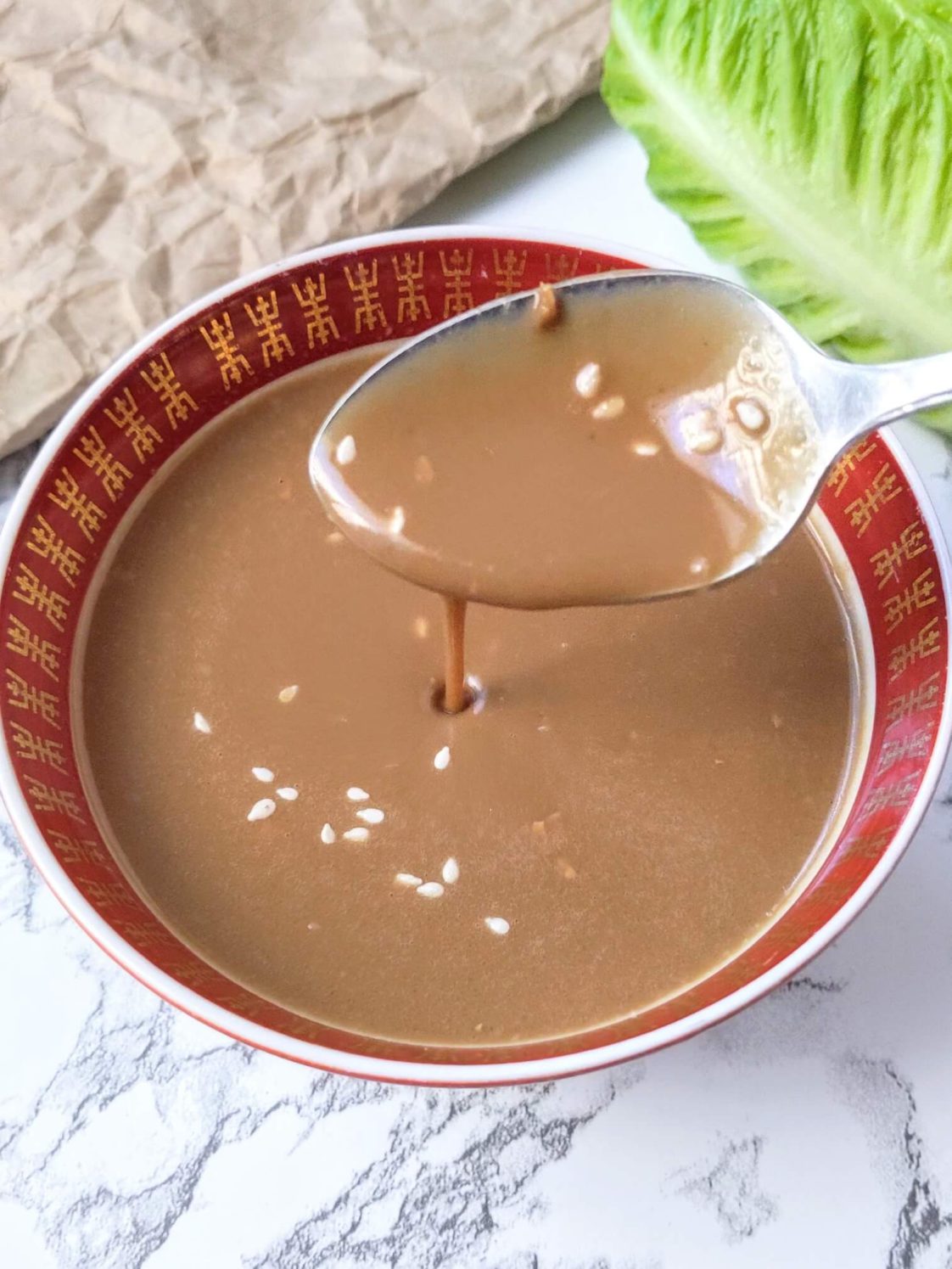 sesame ginger salad dressing with spoon